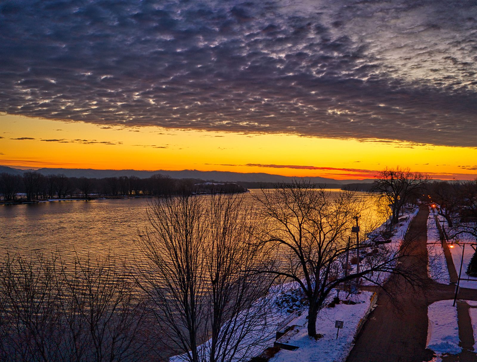 Sunset over the Mississippi River from the bike path beside the club